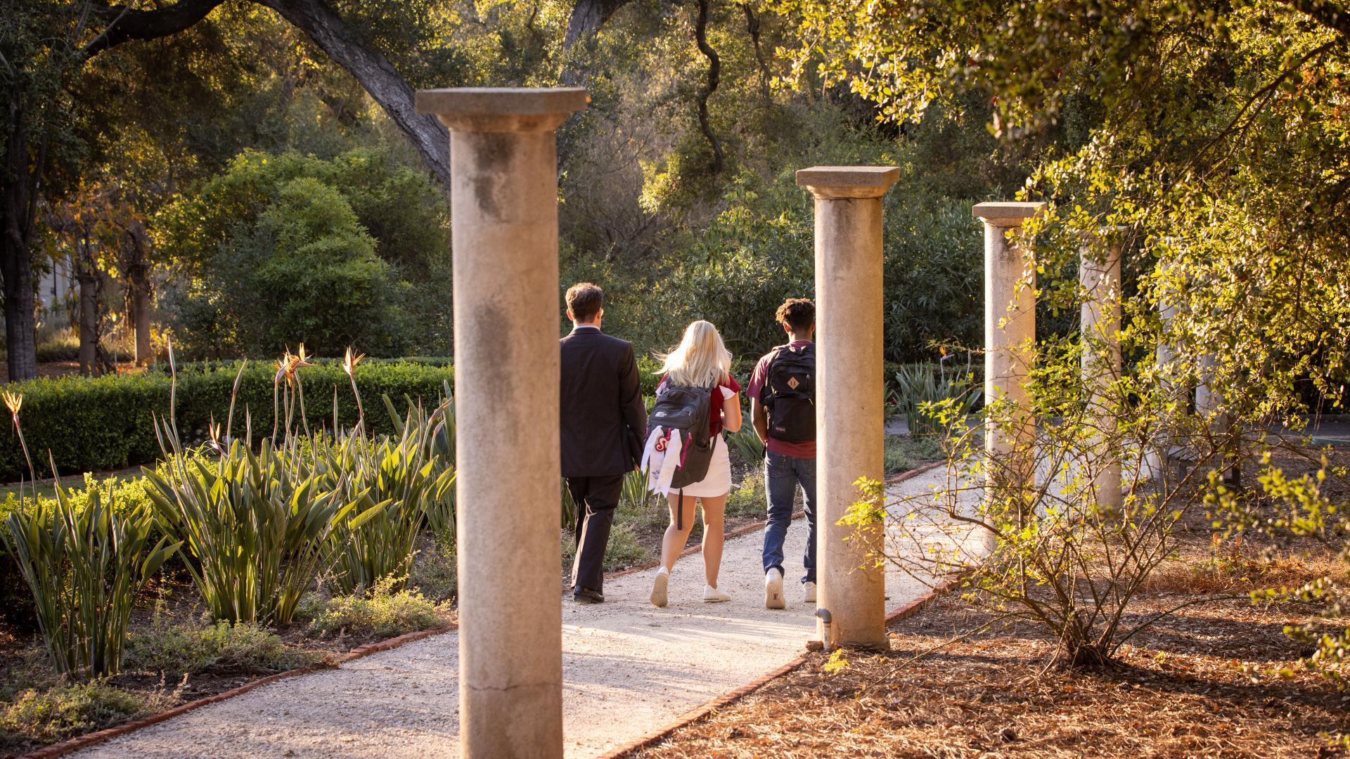 Westmont students walking with professor on campus